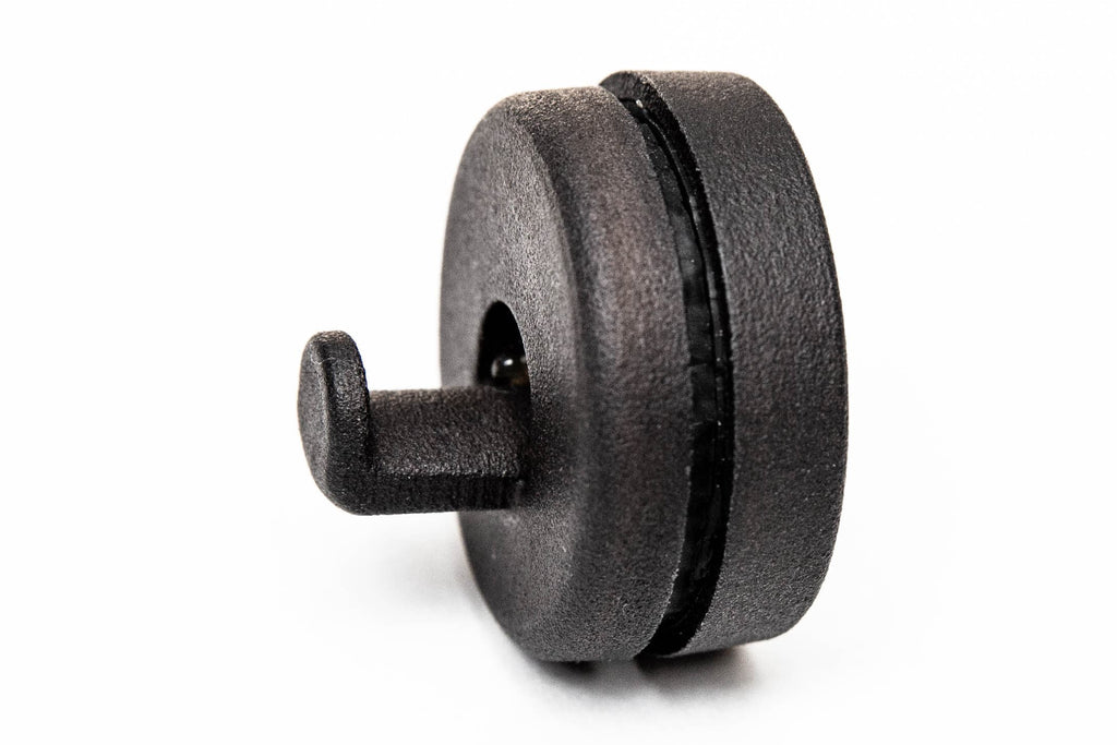 Close-up of the black magnetic wreath hook with its rounded magnet base and short hook