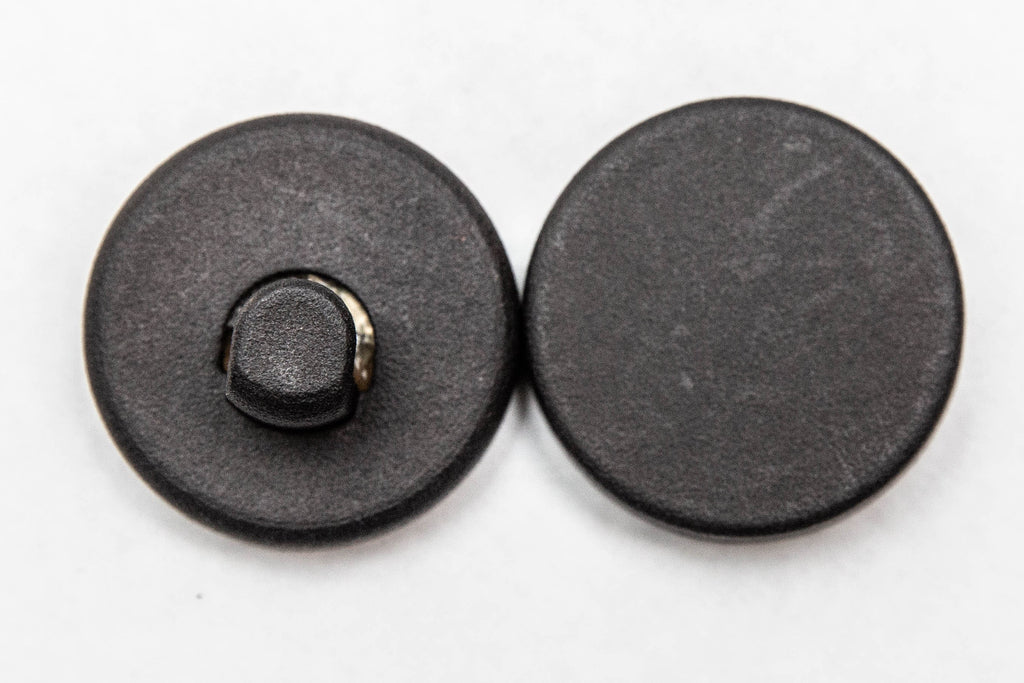 The two magnets of the wreath hanger: the outside hook piece and the inside backing magnet