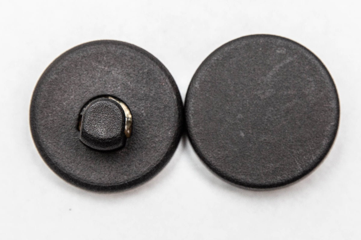 The two magnets of the wreath hanger: the outside hook piece and the inside backing magnet